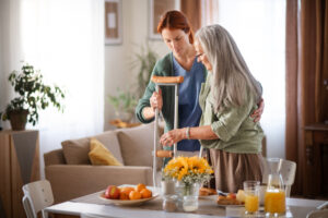 Elderly person receiving personal care services at home in Philadelphia, assisted by a compassionate caregiver.